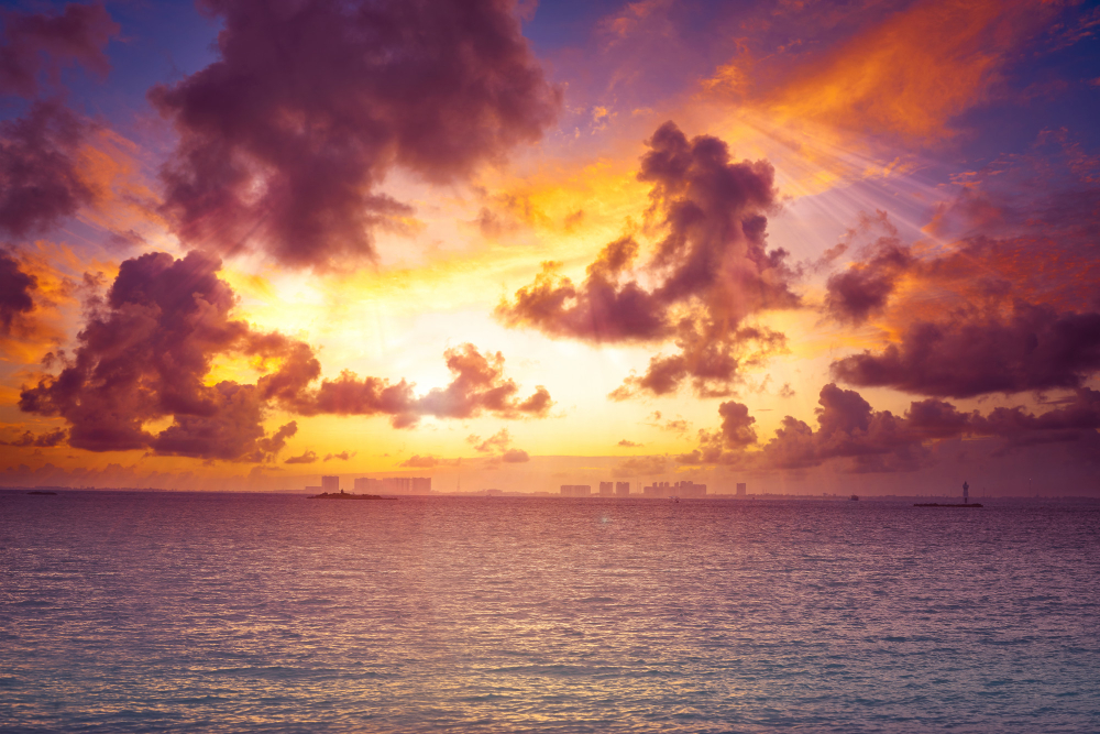 https://tustours.com/wp-content/uploads/2022/08/isla-mujeres-island-caribbean-beach-sunset.jpg